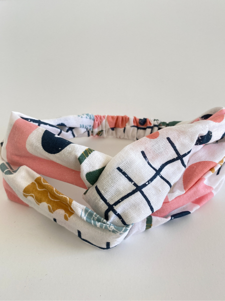 Woven cotton headband in cut out shapes print